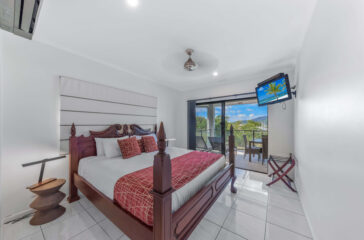 at Waterfront Whitsunday Retreat king bed