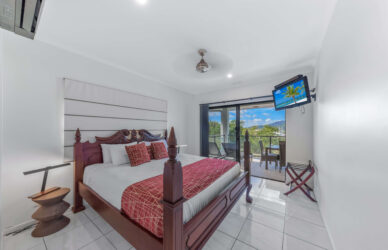 at Waterfront Whitsunday Retreat king bed