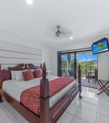 at Waterfront Whitsunday Retreat king bed